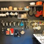 storage space in the kitchen with shelves and hooks