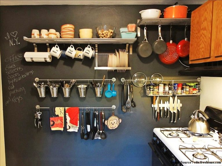 storage space in the kitchen with shelves and hooks